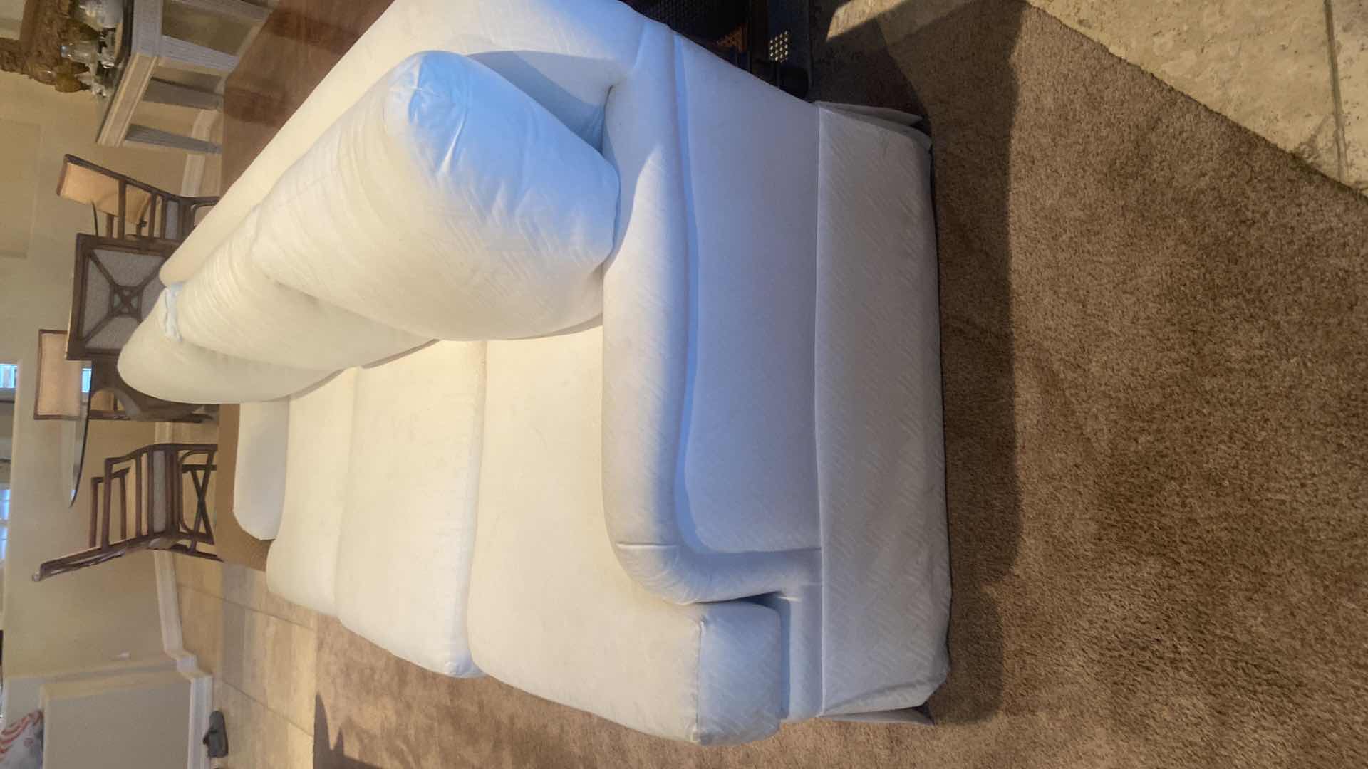 Photo 1 of 84” WHITE UPHOLSTERED 3 CUSHION SOFA WITH 4 22” TOSS PILLOWS