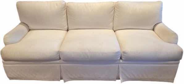 Photo 1 of 84” WHITE UPHOLSTERED 3 CUSHION SOFA WITH 4 22” TOSS PILLOWS
