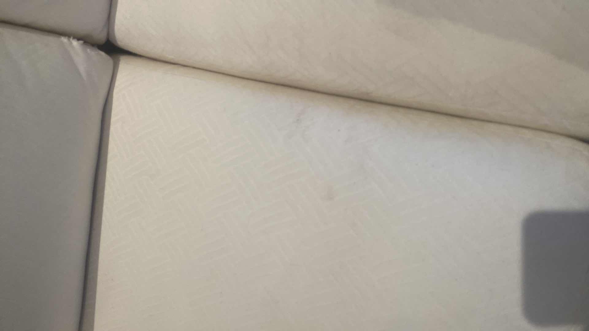 Photo 1 of 84” WHITE UPHOLSTERED 3 CUSHION SOFA WITH 4 22” TOSS PILLOWS