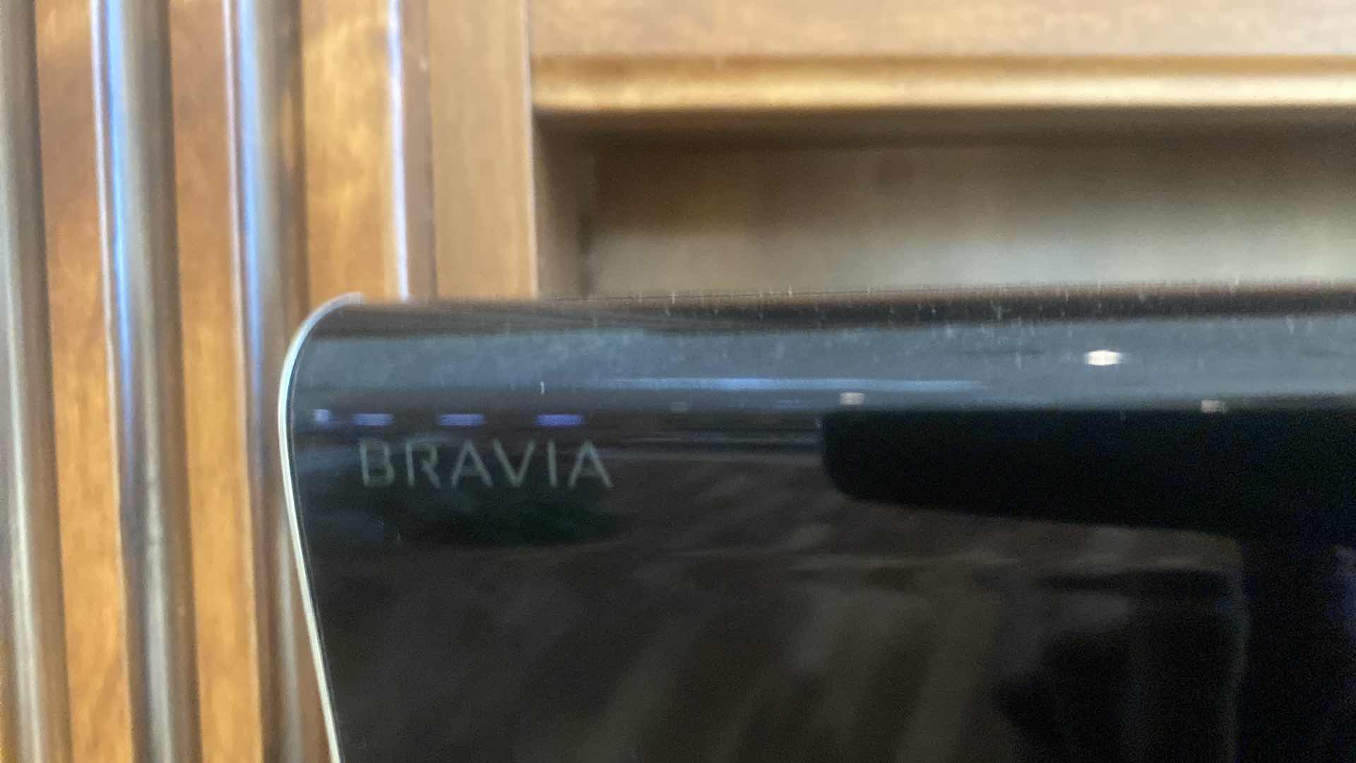 Photo 1 of 75” SONY BRAVIA TELEVISION WITH BUILT-IN SPEAKERS AND WALL MOUNT, INCLUDES SONY BLU-RAY DVD PLAYER