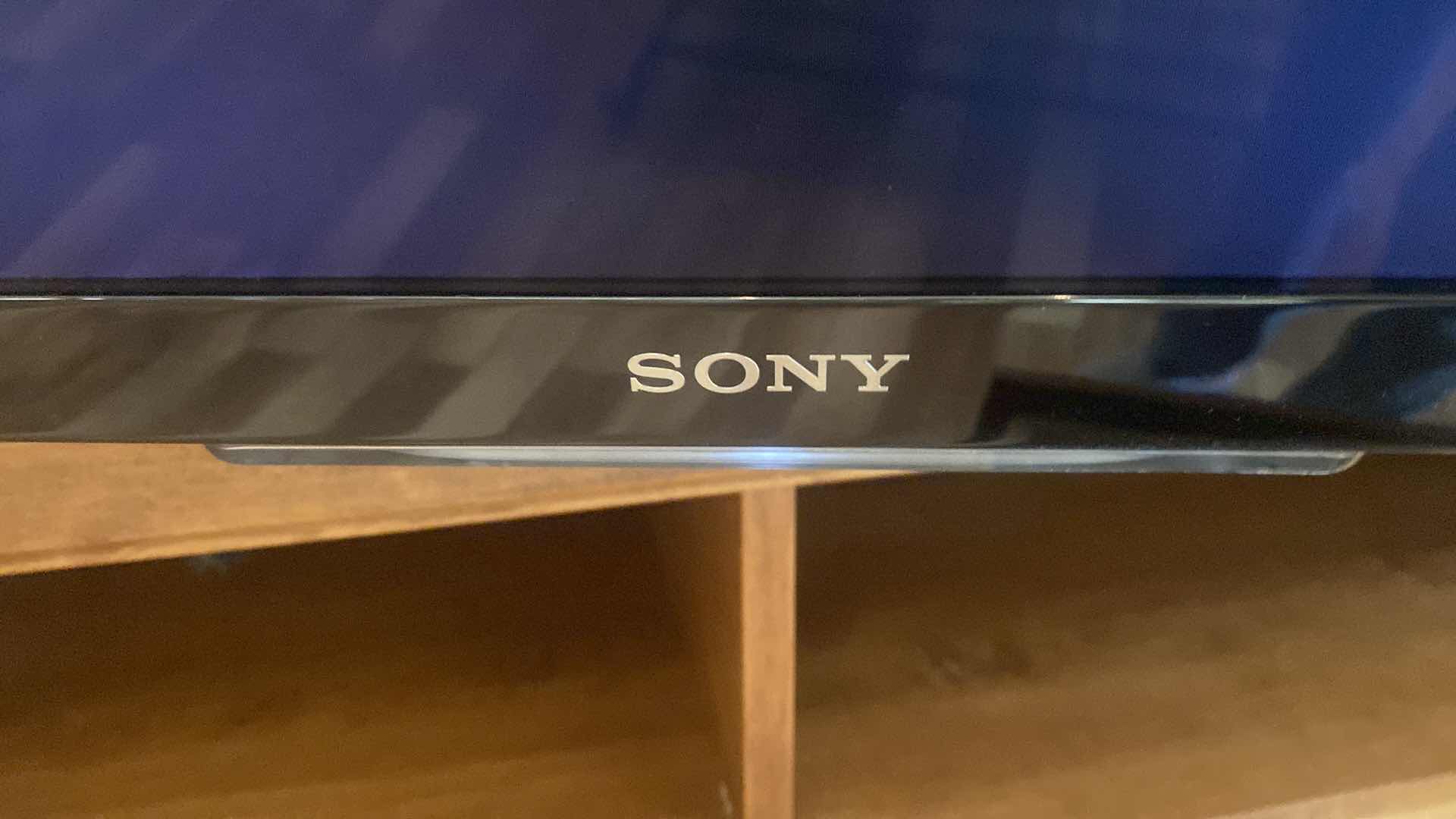 Photo 1 of 75” SONY BRAVIA TELEVISION WITH BUILT-IN SPEAKERS AND WALL MOUNT, INCLUDES SONY BLU-RAY DVD PLAYER