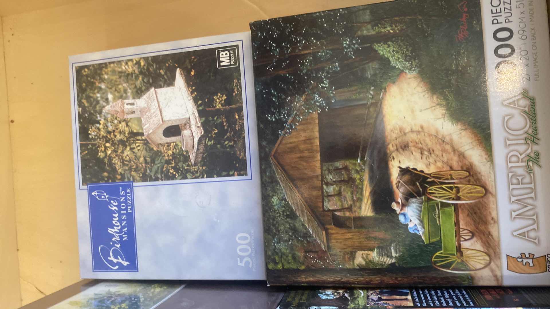 Photo 1 of CONTENTS OF DRAWER, VHS MOVIES, PUZZLES, AND FAUX BOOK DECOR