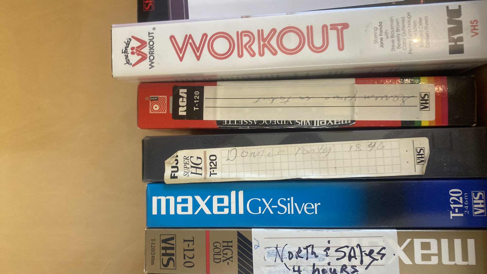 Photo 1 of CONTENTS OF DRAWER, VHS MOVIES, PUZZLES, AND FAUX BOOK DECOR