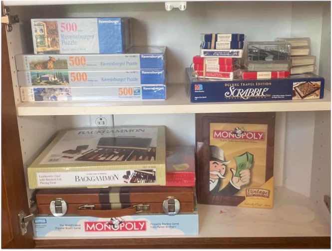 Photo 1 of CONTENTS OF CABINET BOARD GAMES AND PUZZLES