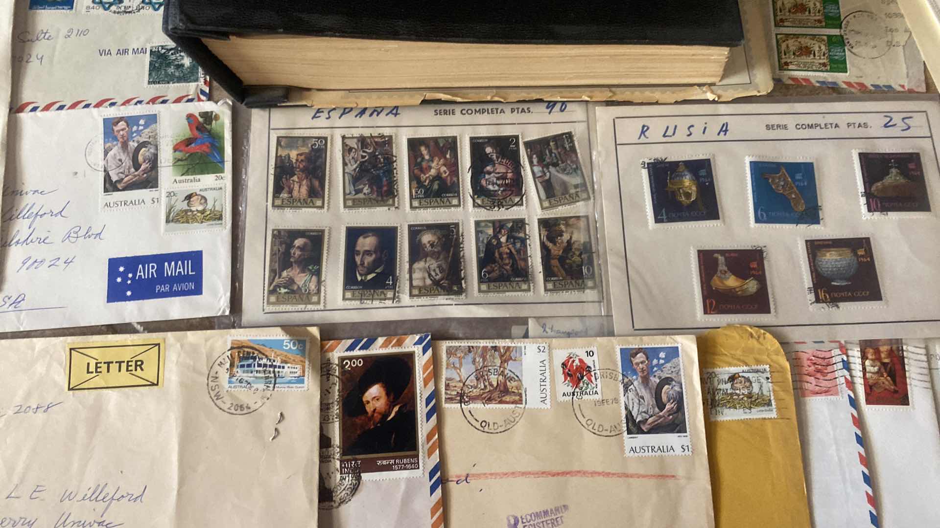 Photo 1 of THE COMPREHENSIVE WORLDWIDE STAMP ALBUM WITH ASSORTMENT OF STAMPS