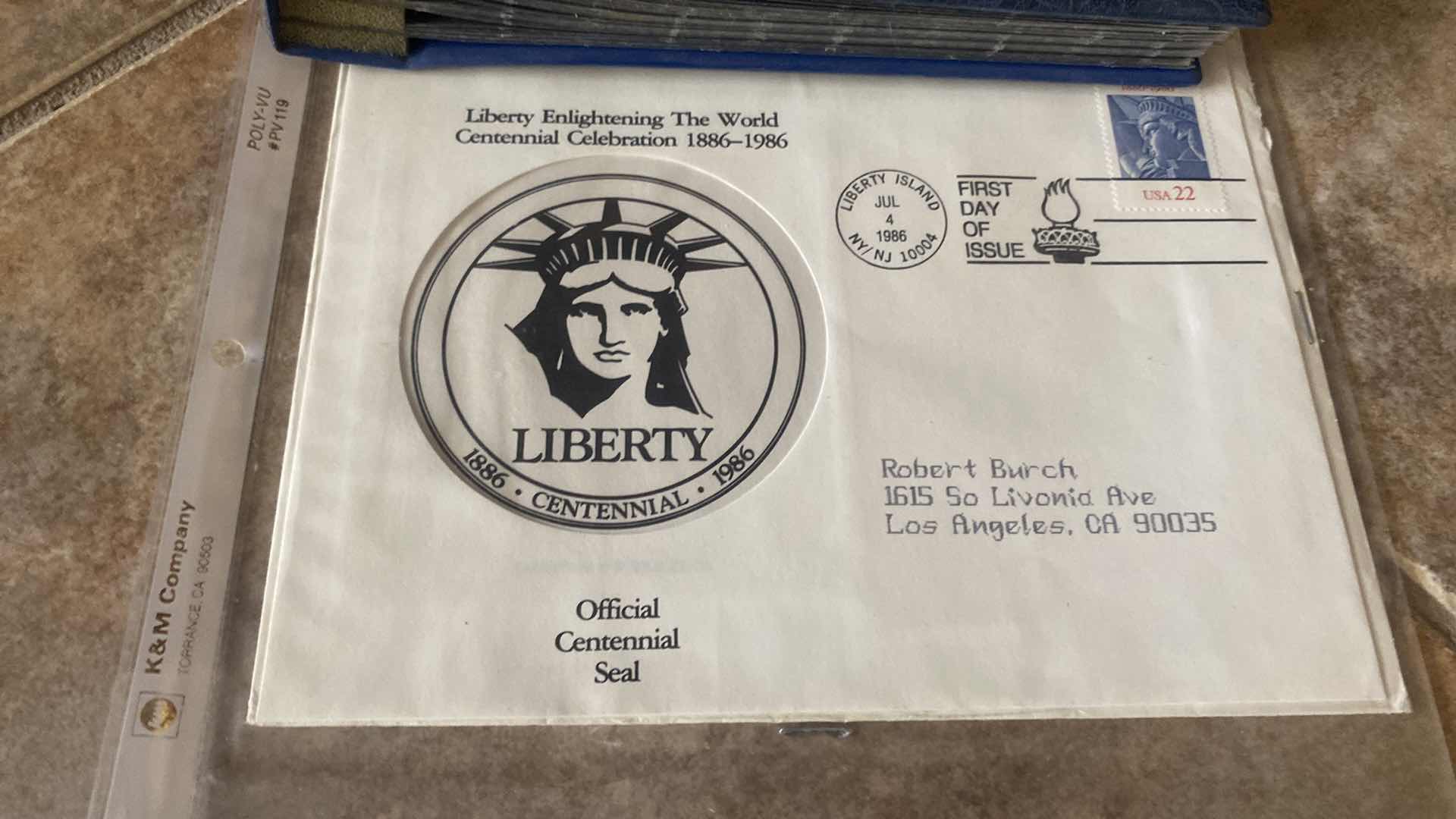 Photo 1 of STAMP COLLECTION ALBUM AND TWO OFFICIAL CENTENNIAL SEAL STATUE OF LIBERTY RESTORATION