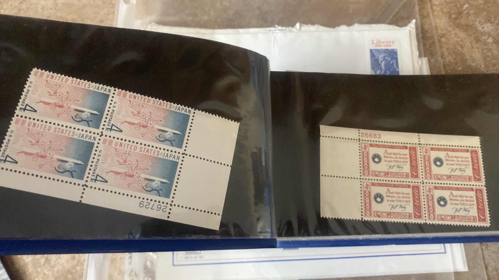 Photo 1 of STAMP COLLECTION ALBUM AND TWO OFFICIAL CENTENNIAL SEAL STATUE OF LIBERTY RESTORATION