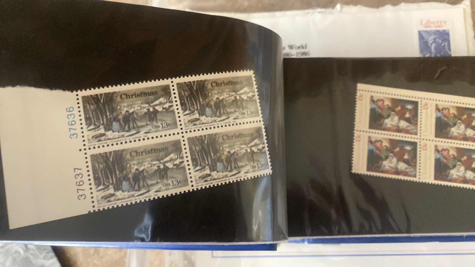 Photo 1 of STAMP COLLECTION ALBUM AND TWO OFFICIAL CENTENNIAL SEAL STATUE OF LIBERTY RESTORATION