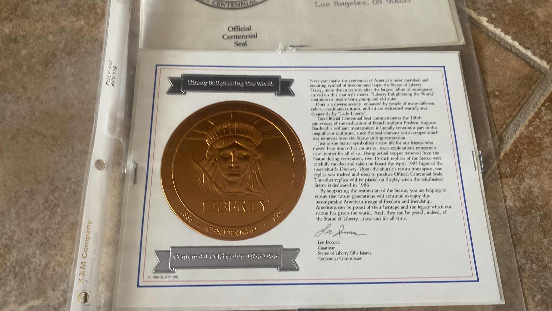 Photo 1 of STAMP COLLECTION ALBUM AND TWO OFFICIAL CENTENNIAL SEAL STATUE OF LIBERTY RESTORATION