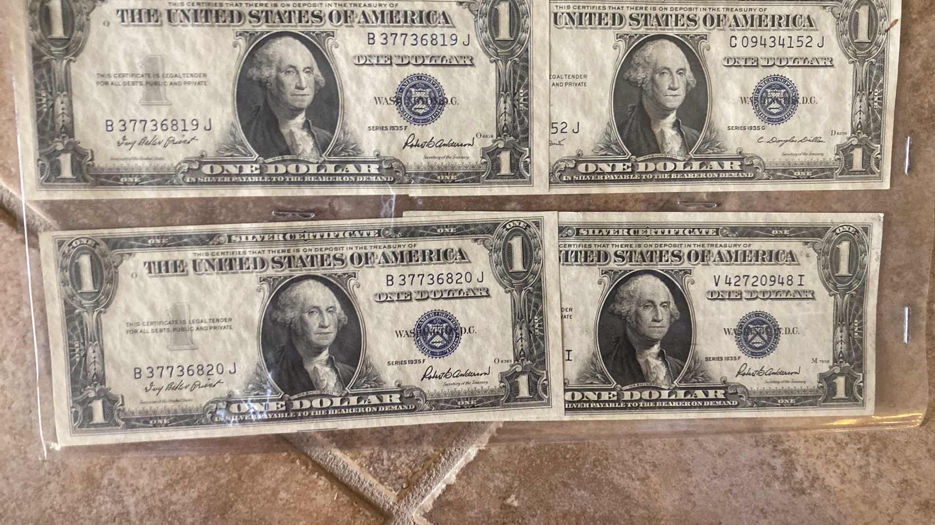 Photo 1 of VINTAGE 1957 & 1935 CIRCULATED SILVER CERTIFICATES ONE DOLLAR BILLS