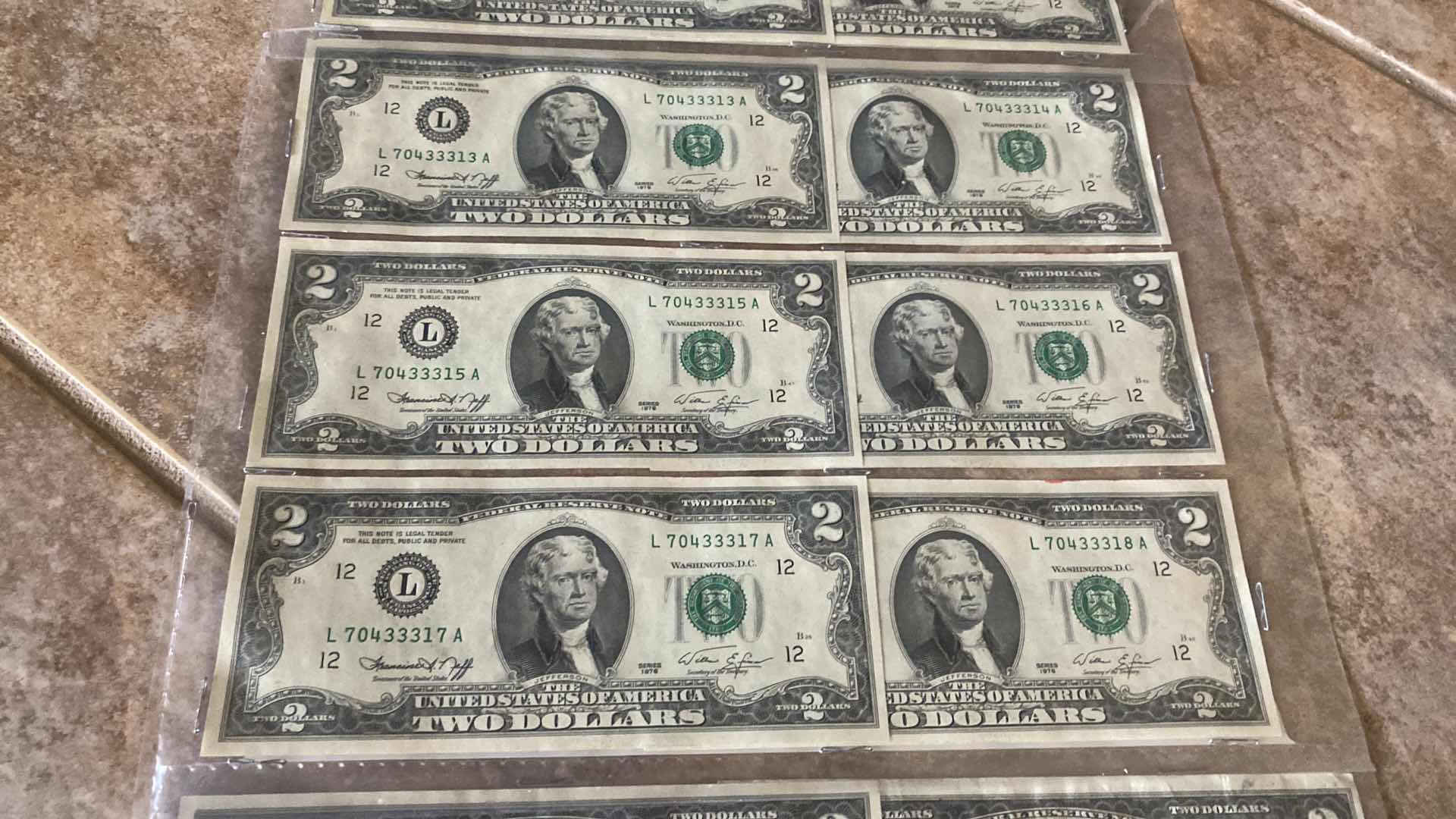 Photo 1 of 17-VINTAGE 1976 CIRCULATED $2 DOLLAR BILLS