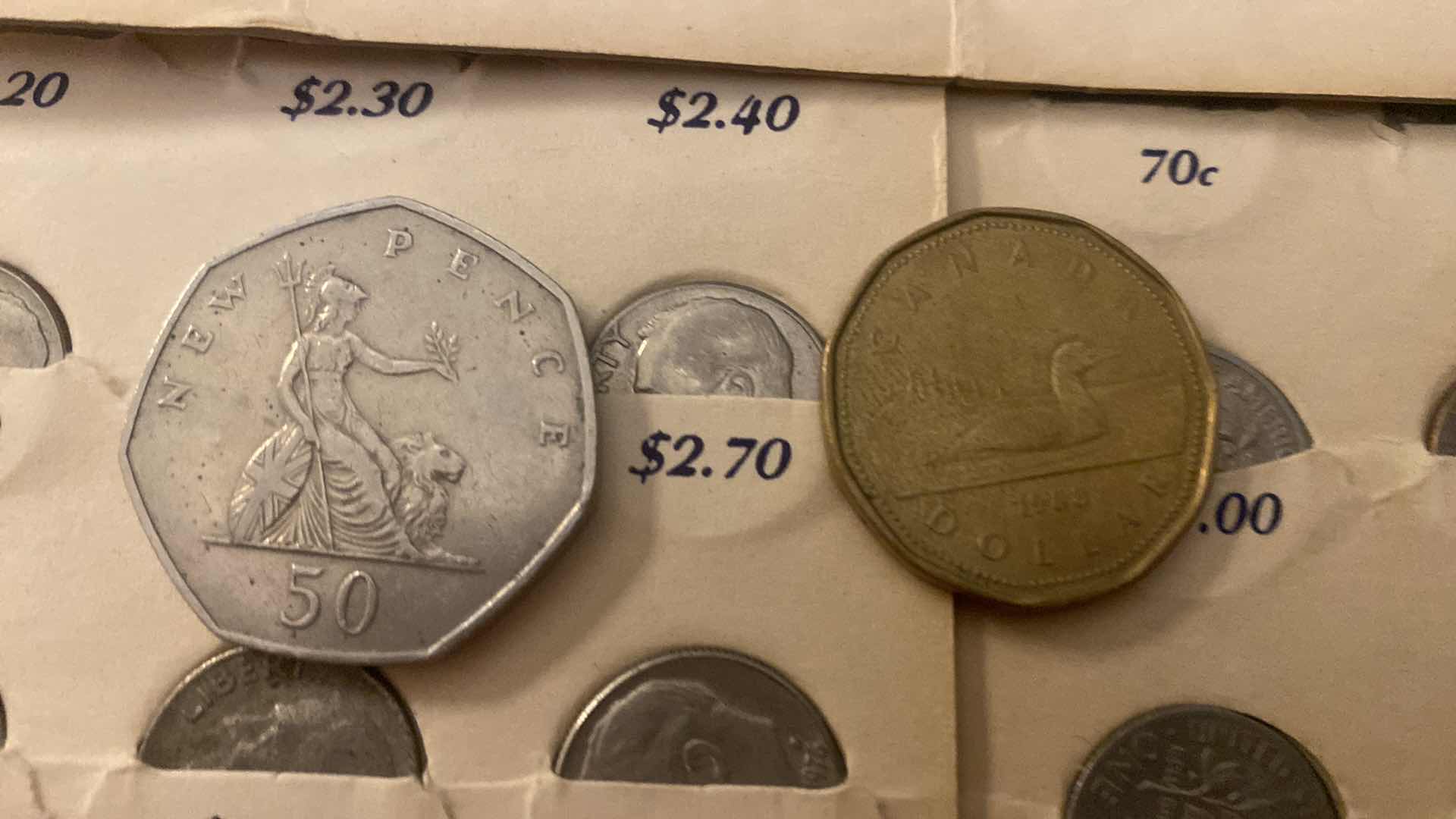 Photo 1 of 5-POCKET DIME SAVERS AND A NEW PENCE & ONE CANADIAN DOLLAR