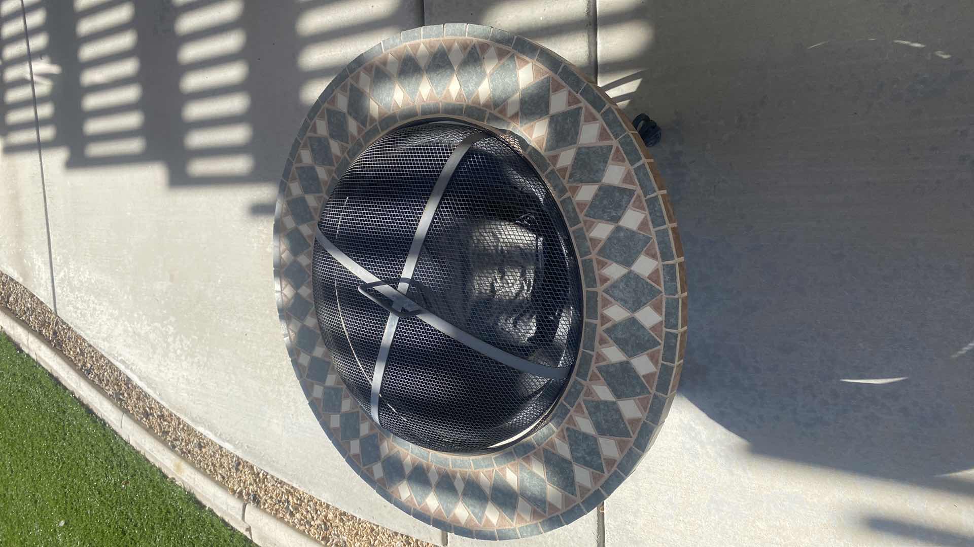 Photo 1 of 34” ROUND FIRE PIT WITH TILE TRIM AND HEAVY CAST METAL BASE)