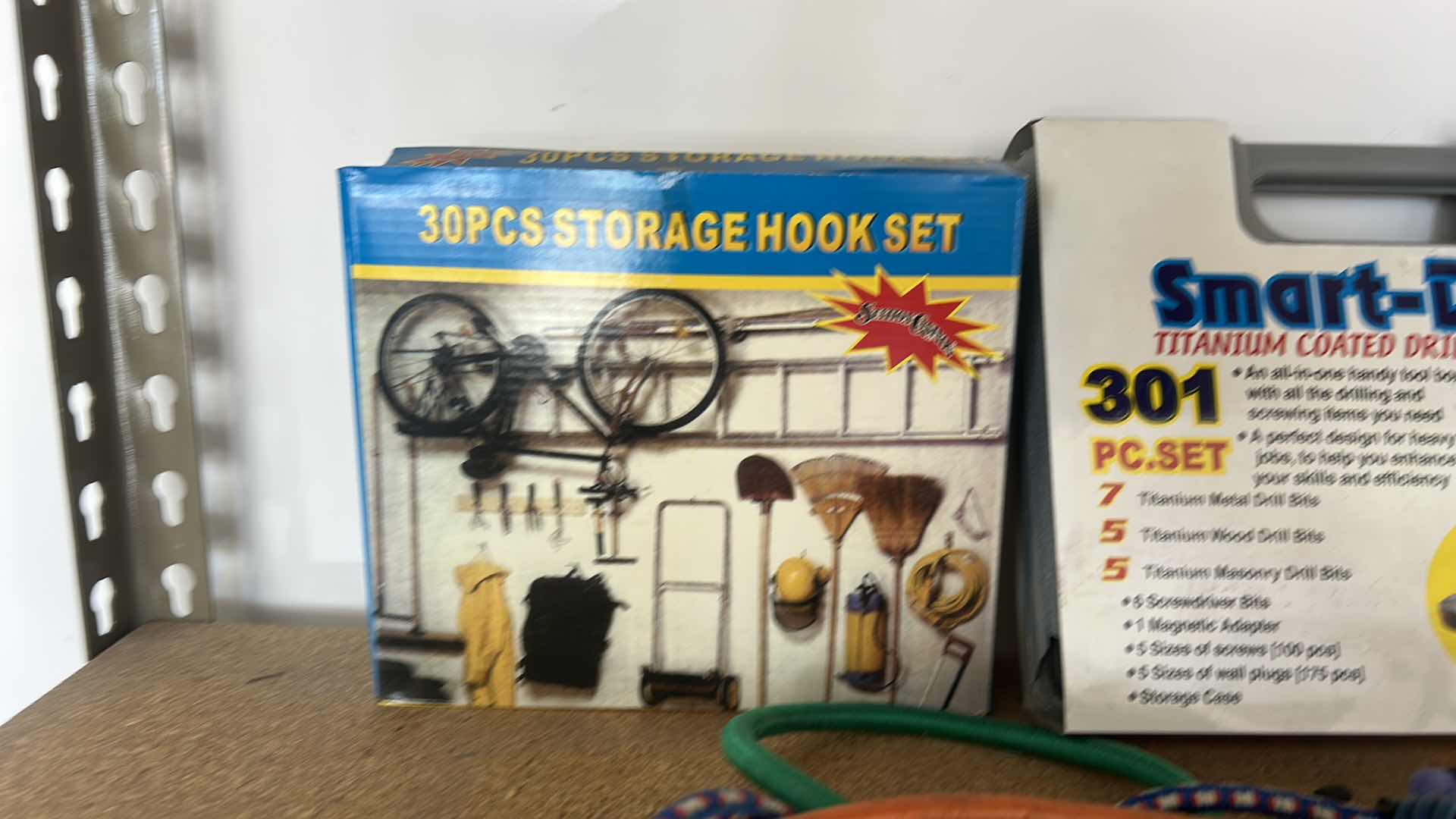 Photo 1 of GARAGE ITEMS – 30 PIECE STORAGE HOOK, SET, SMART DRILL, BASIN, WRENCH, AND BUNGEES