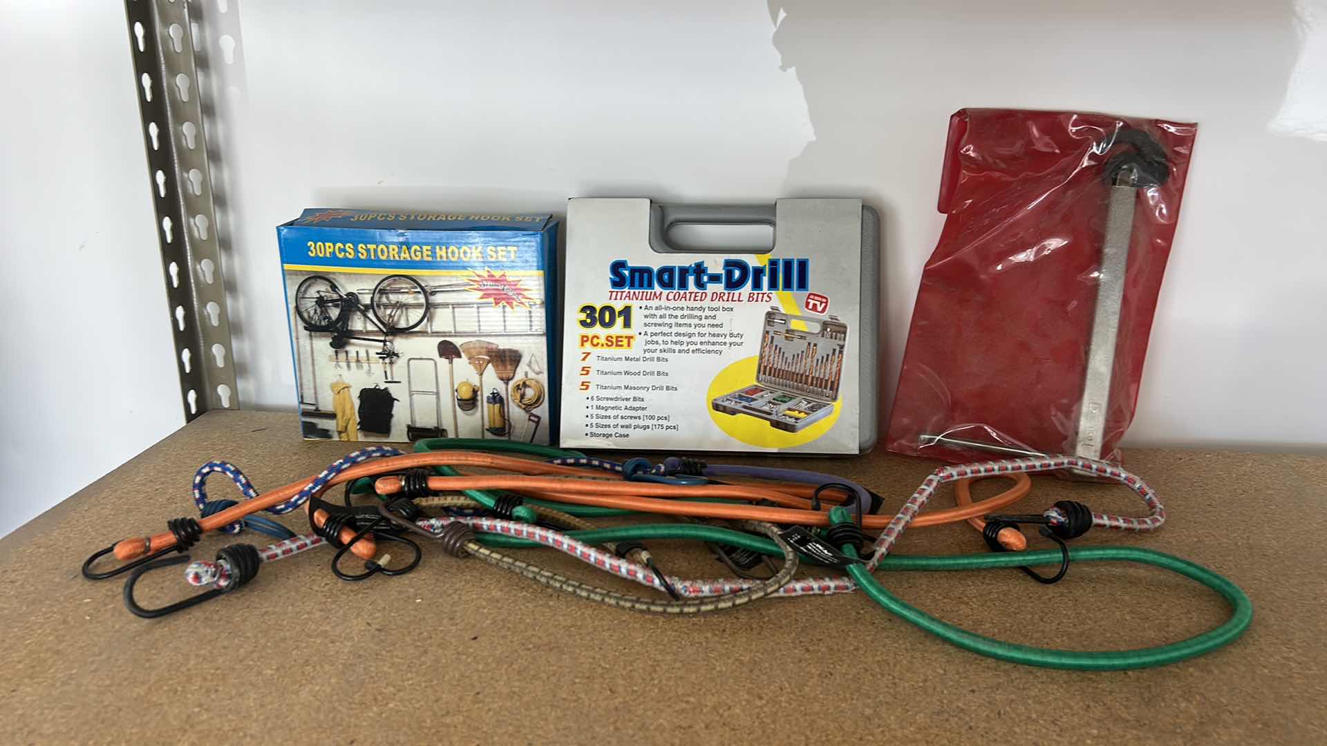 Photo 1 of GARAGE ITEMS – 30 PIECE STORAGE HOOK, SET, SMART DRILL, BASIN, WRENCH, AND BUNGEES