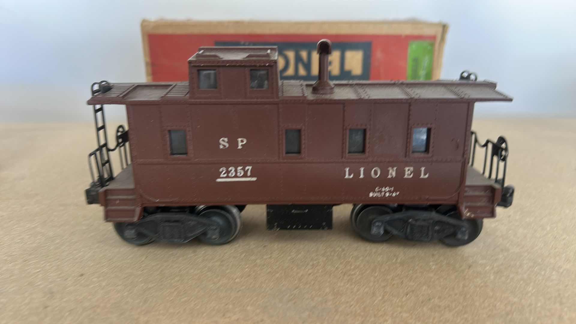 Photo 1 of VINTAGE LIONEL POSTWAR NO. 2357 SOUTHERN PACIFIC (SP) CABOOSE IN TUSCAN BROWN.