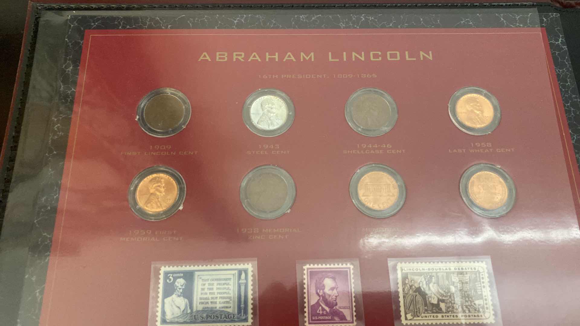 Photo 1 of PRESIDENTIAL COMMEMORATIVE COIN AND STAMP PORTFOLIO LINCOLN, WASHINGTON, JEFFERSON, KENNEDY, ROOSEVELT, AND EISENHOWER