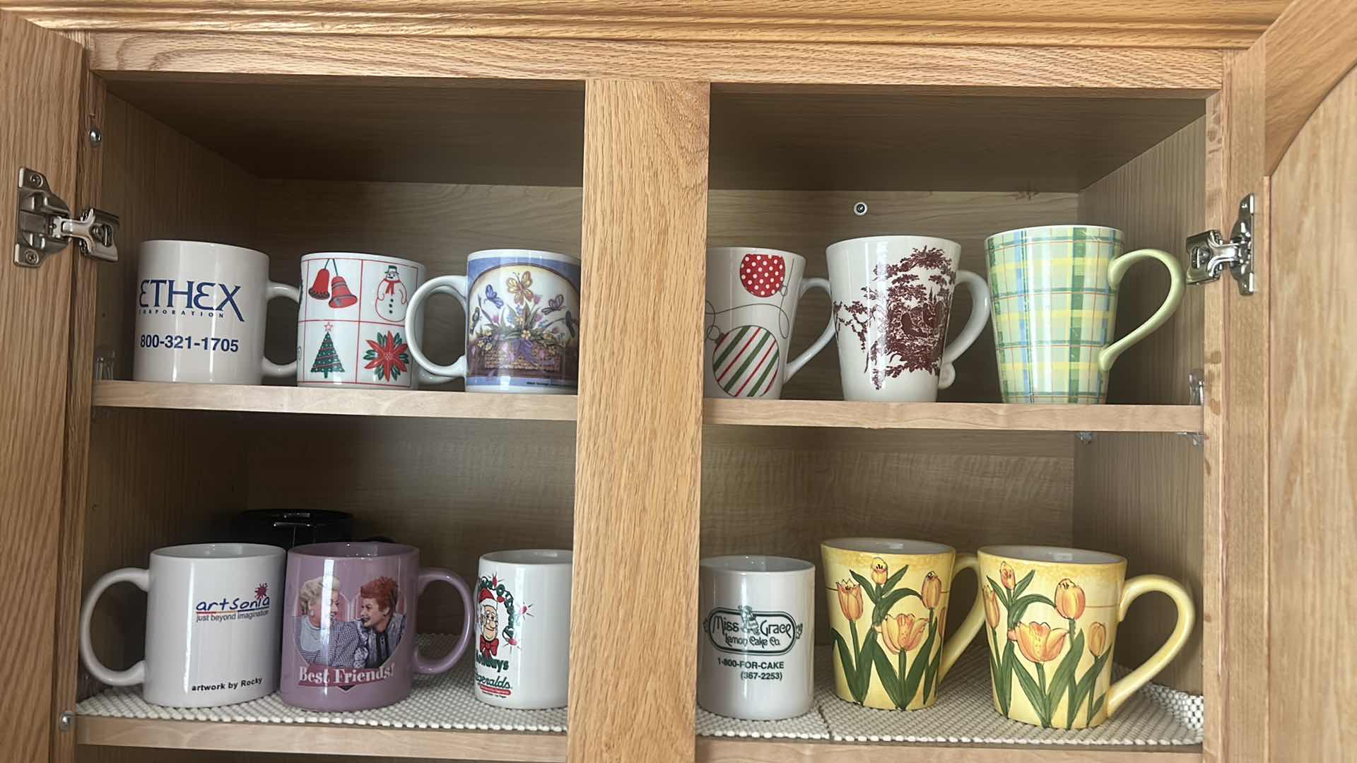 Photo 1 of CONTENTS OF CABINET IN KITCHEN-COFFEE MUGS AND MORE