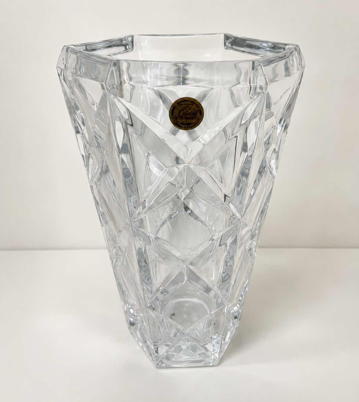 View 1 of CRISTAL ARQUES FRANCE - HAND CUT LEAD CRYSTAL VASE WITH GEOMETRIC FACETED DESIGN AND ORIGINAL LABEL.

ESTIMATED RETAIL VALUE: $75–$125 H9.5”
