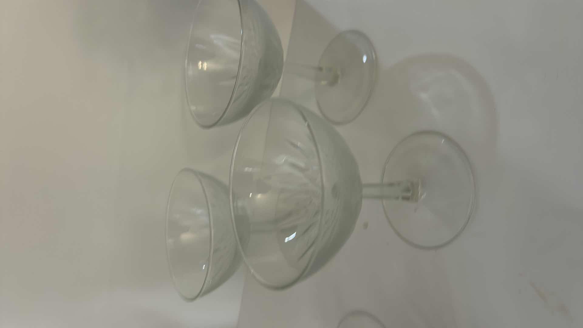 Photo 1 of ASSORTED CLEAR CRYSTAL STEMWARE INCLUDING WINE GLASSES, CHAMPAGNE COUPES AND SMALL CRYSTAL VASE.
ELEGANT CUT-CRYSTAL DESIGN WITH MATCHING PATTERN.
ESTIMATED RETAIL VALUE: $125 FOR THE GROUP.