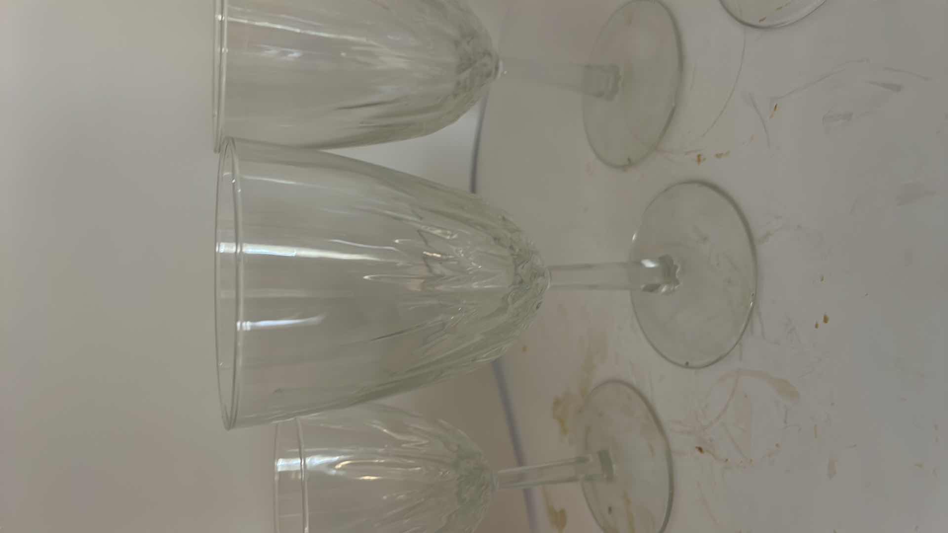 Photo 1 of ASSORTED CLEAR CRYSTAL STEMWARE INCLUDING WINE GLASSES, CHAMPAGNE COUPES AND SMALL CRYSTAL VASE.
ELEGANT CUT-CRYSTAL DESIGN WITH MATCHING PATTERN.
ESTIMATED RETAIL VALUE: $125 FOR THE GROUP.