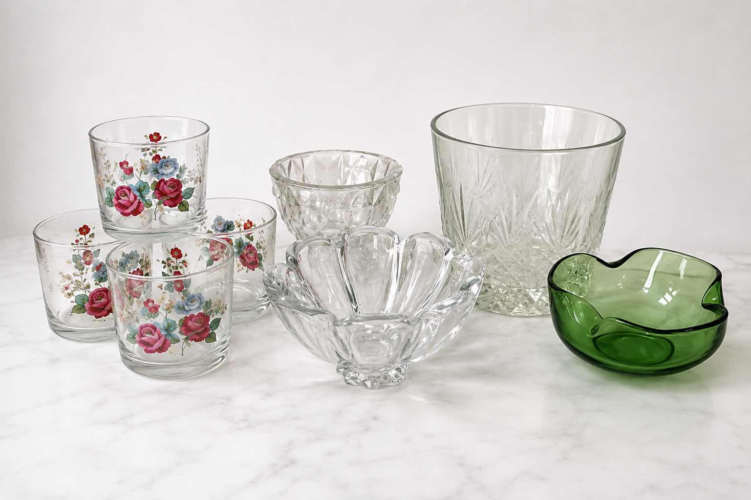 Photo 1 of ASSORTED VINTAGE GLASSWARE INCLUDING 4 FLORAL TUMBLERS, CLEAR PRESSED GLASS BOWLS AND GREEN ART GLASS DISH.