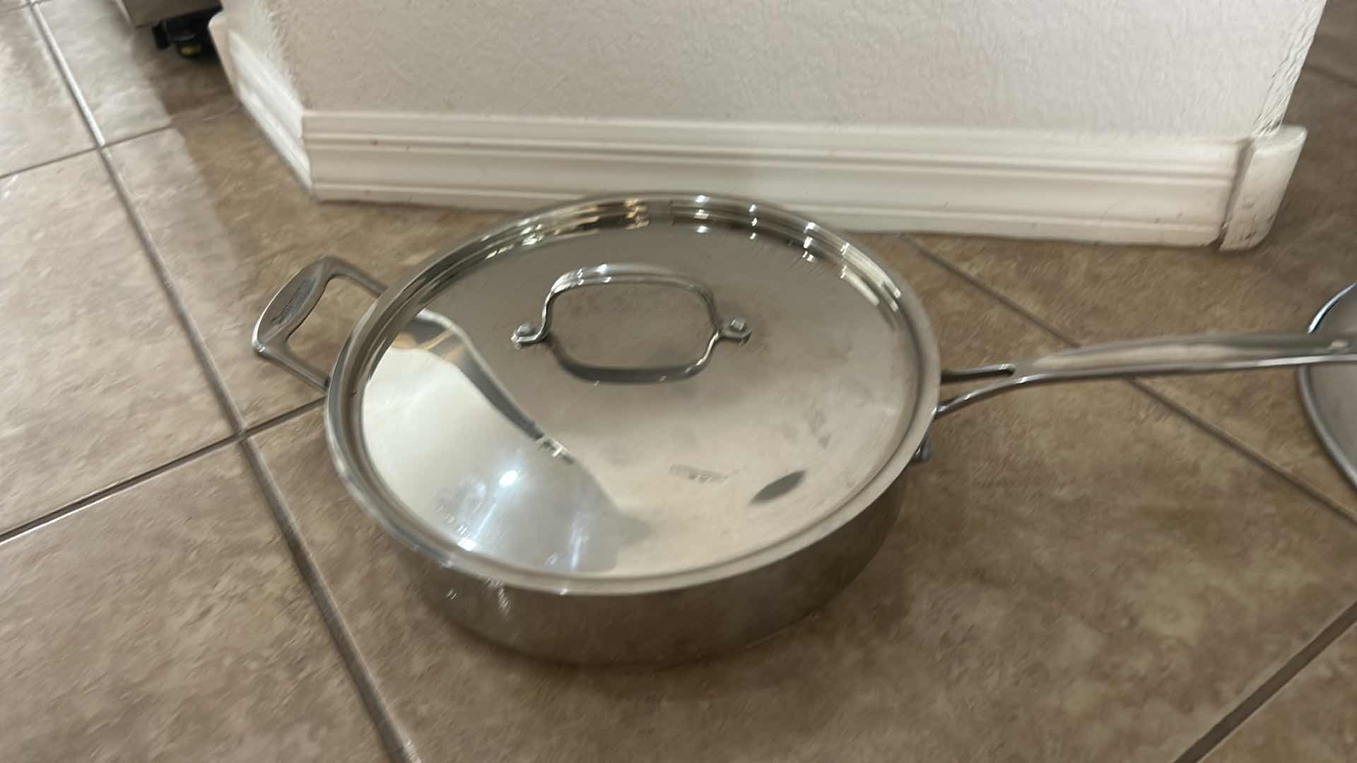 Photo 1 of ASSORTED COOKWARE LOT WITH WOKS, SKILLET, LIDDED PAN & DOME LIDS
MIXED STAINLESS STEEL AND NONSTICK COOKWARE
ESTIMATED RETAIL VALUE: $100–$150