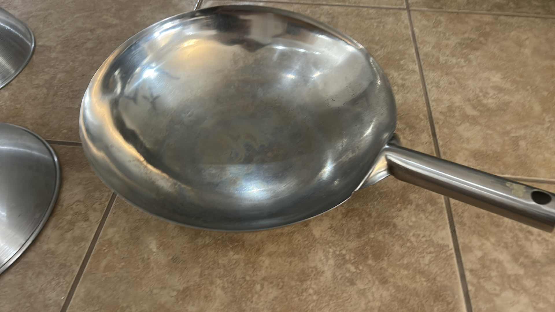 Photo 1 of ASSORTED COOKWARE LOT WITH WOKS, SKILLET, LIDDED PAN & DOME LIDS
MIXED STAINLESS STEEL AND NONSTICK COOKWARE
ESTIMATED RETAIL VALUE: $100–$150