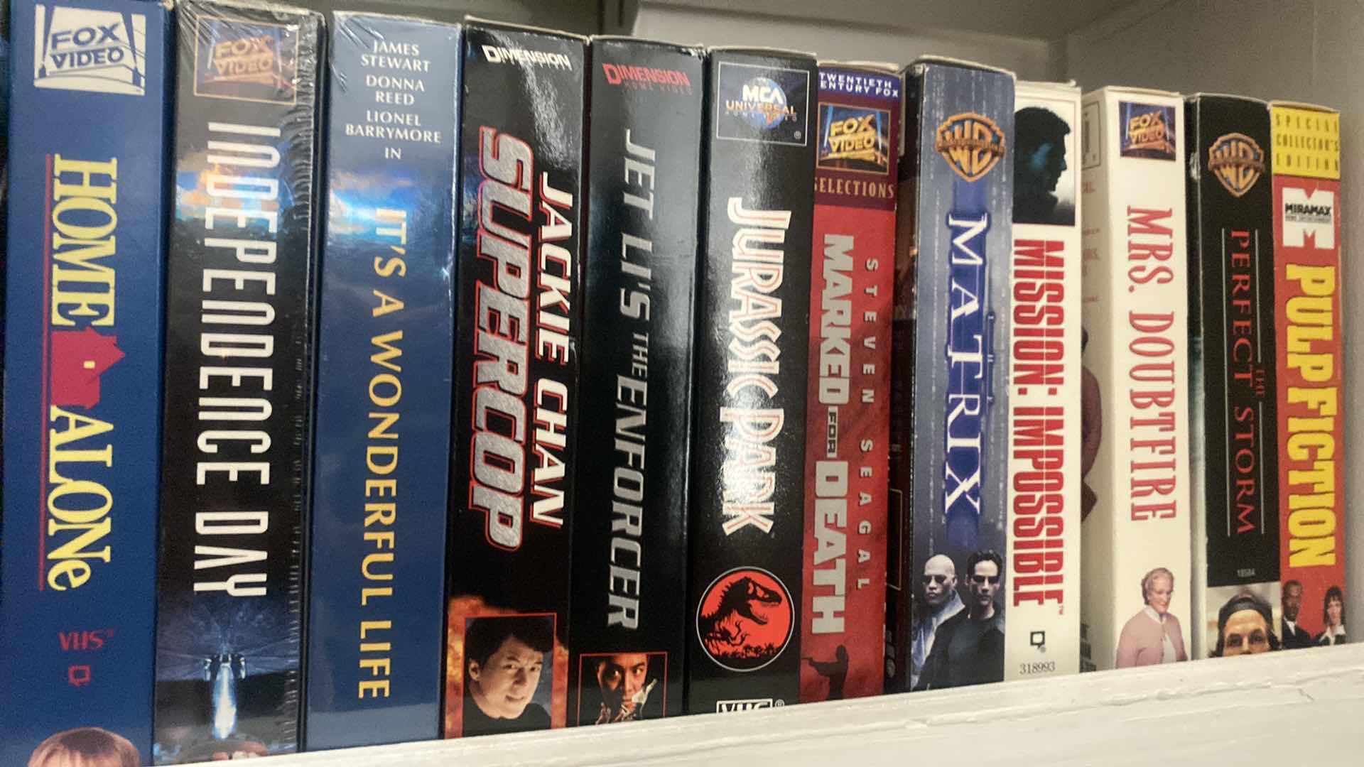 Photo 1 of SHELF OF VHS MOVIES SEE PICTURES