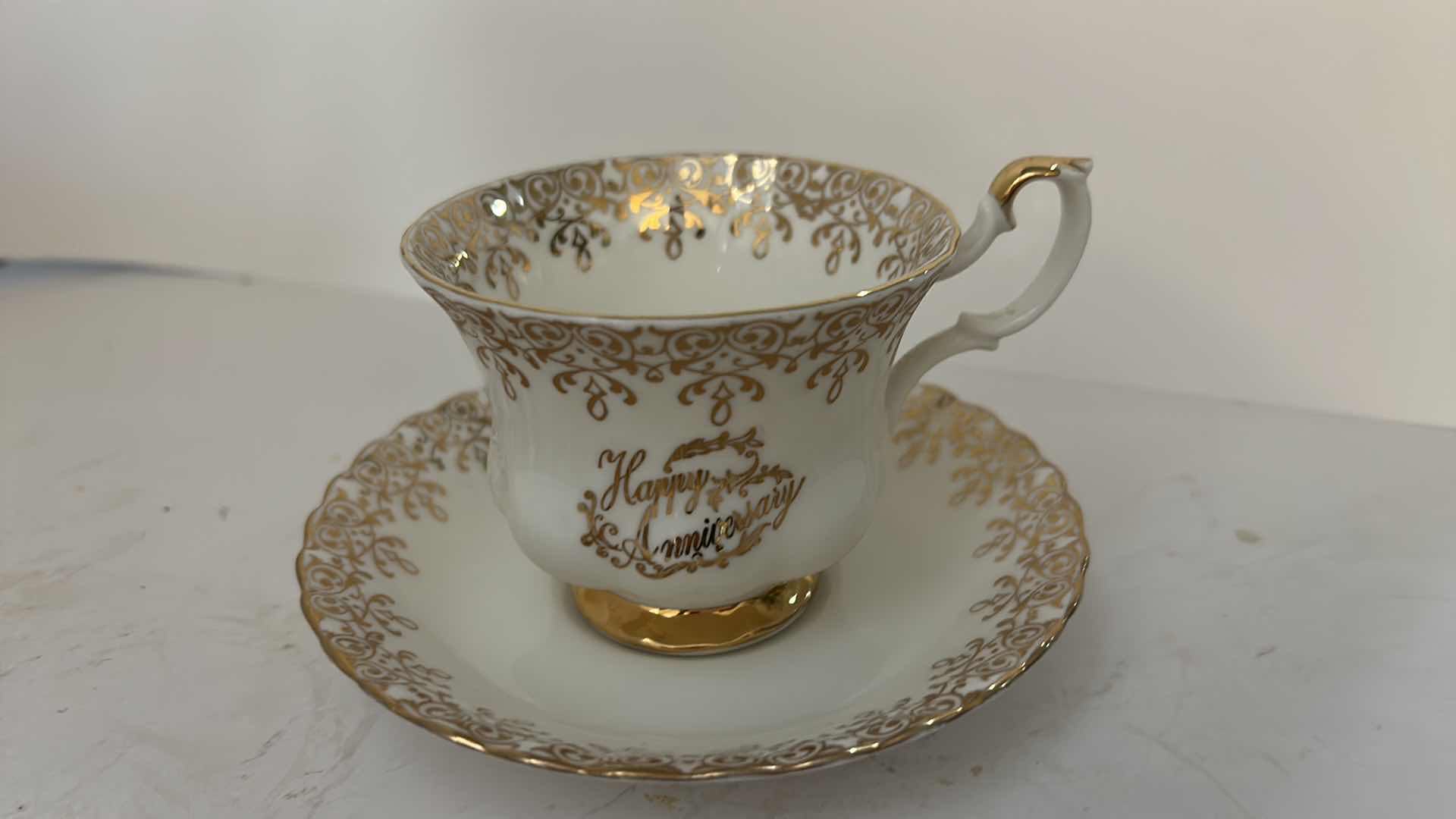 Photo 1 of ROYAL ALBERT FINE BONE CHINA, HAPPY ANNIVERSARY TEA CUP AND SAUCER