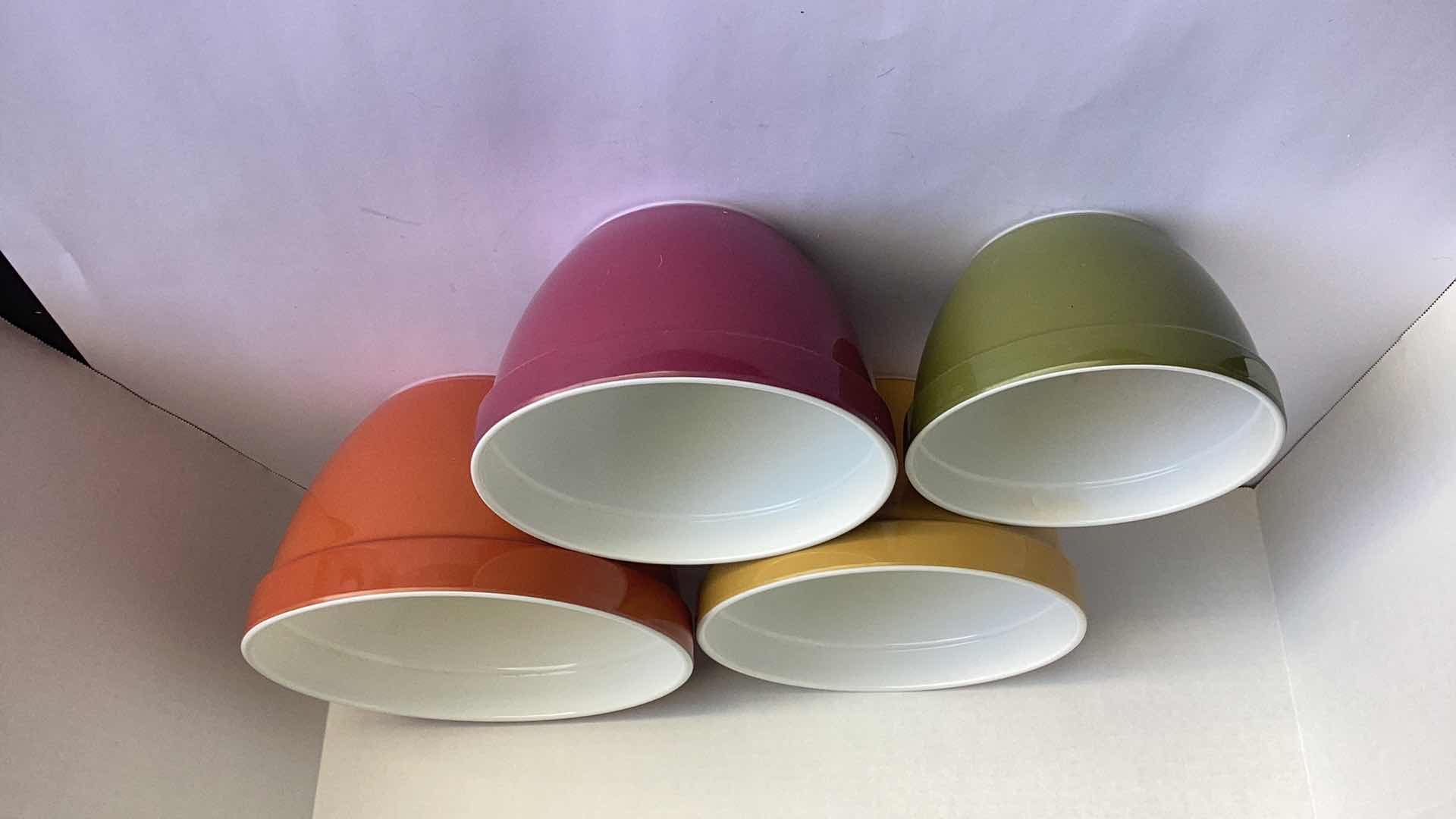 Photo 1 of MANUAL JUICE PRESS AND 4 PLASTIC BOWLS