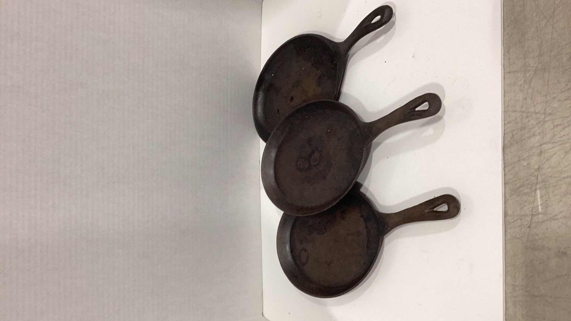 Photo 1 of THREE METAL STEAK IRONS