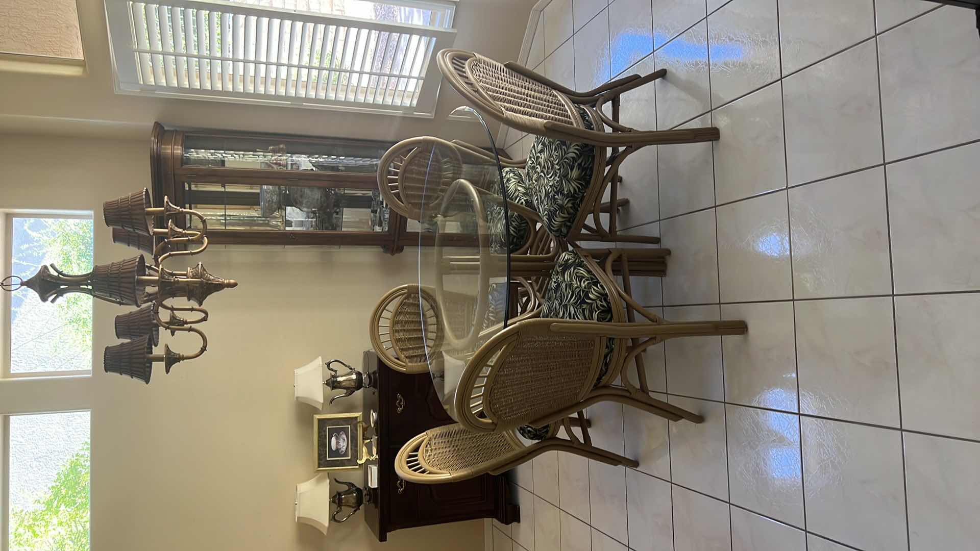 Photo 1 of 48” ROUND GLASSTOP CANE BASE TABLE  W 5 SIDE CHAIRS COVERED IN BLACK & GREEN LEAF UPHOLSTERY (H30")