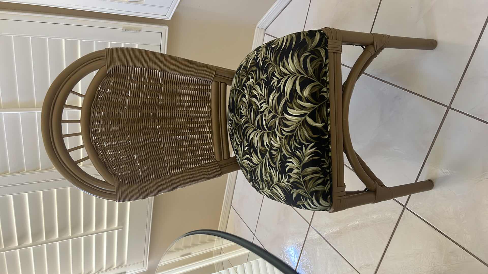 Photo 1 of 48” ROUND GLASSTOP CANE BASE TABLE  W 5 SIDE CHAIRS COVERED IN BLACK & GREEN LEAF UPHOLSTERY (H30")