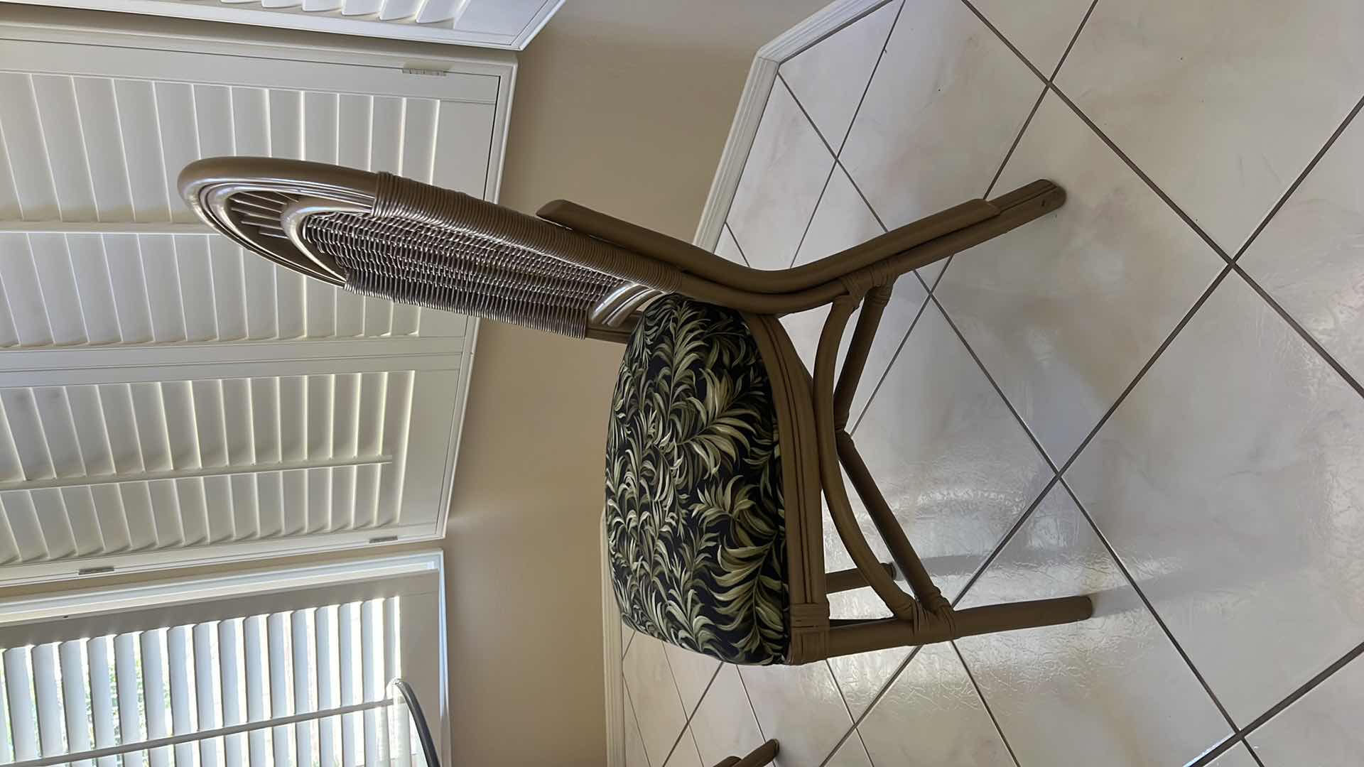 Photo 1 of 48” ROUND GLASSTOP CANE BASE TABLE  W 5 SIDE CHAIRS COVERED IN BLACK & GREEN LEAF UPHOLSTERY (H30")