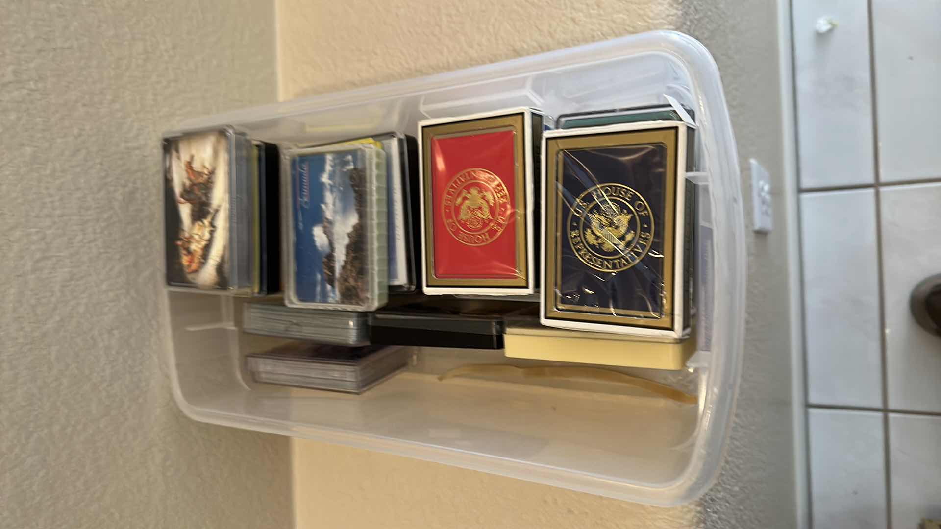 Photo 1 of PLASTIC CONTAINER W VARIETY OF PLAYING CARDS