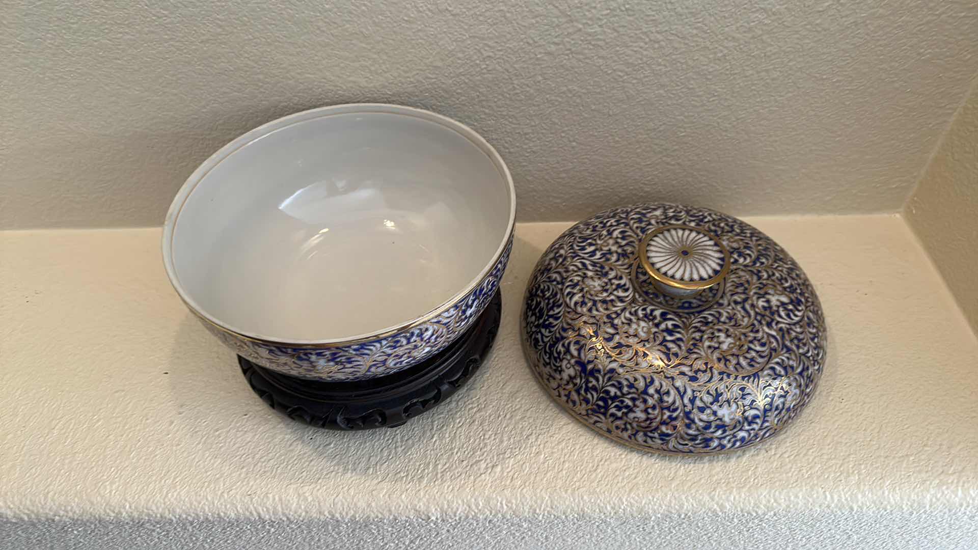 Photo 1 of COLLECTIBLE BLUE WHITE W GOLD TRIM PORCELAIN BOWL W LID ON WOOD STAND