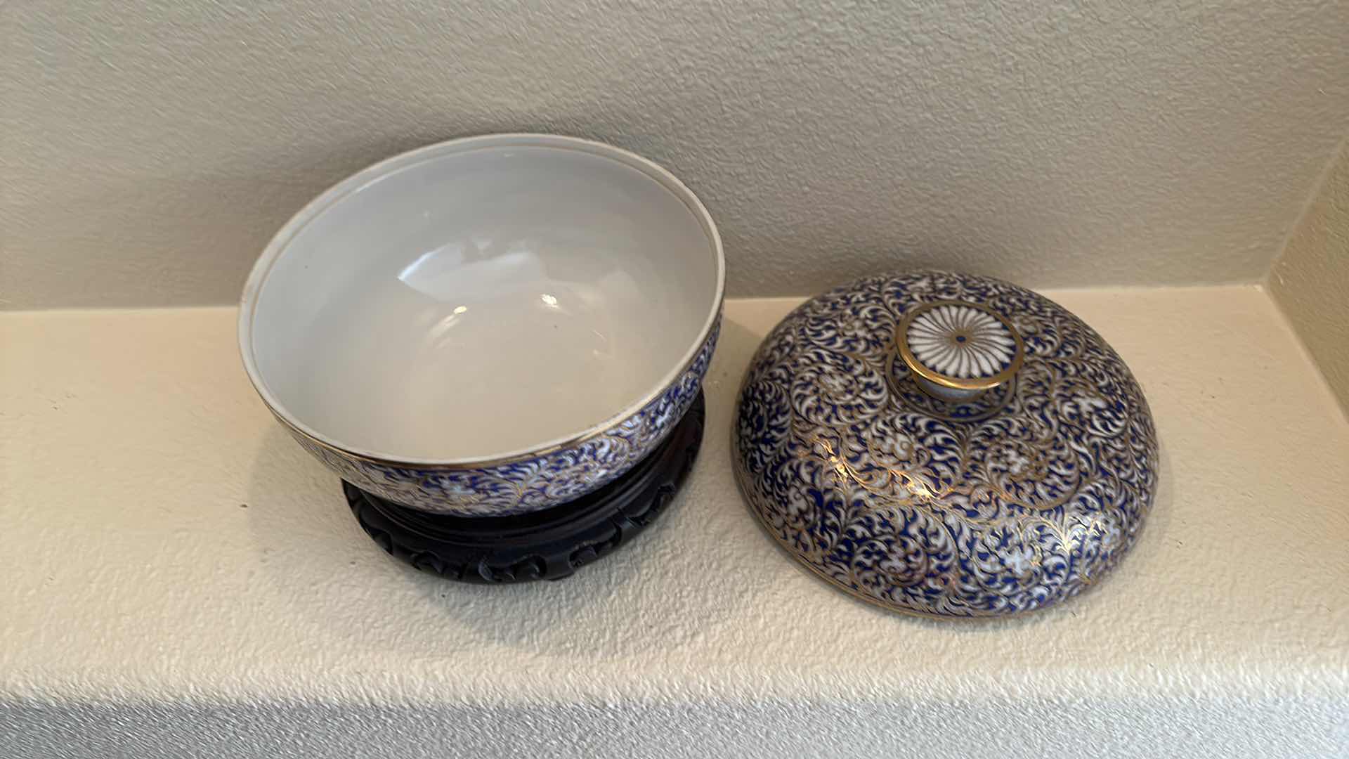 Photo 1 of COLLECTIBLE BLUE WHITE W GOLD TRIM PORCELAIN BOWL W LID ON WOOD STAND