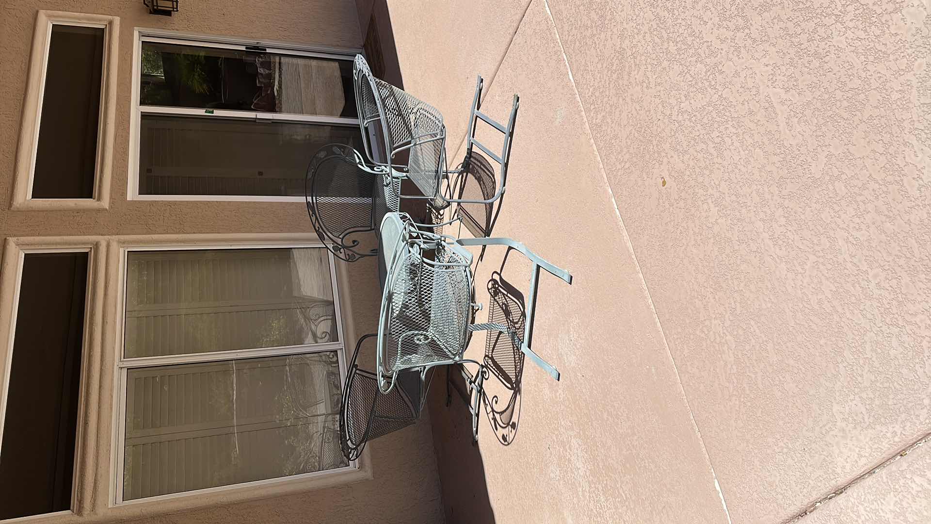 Photo 1 of GREEN WROUGHT IRON PATIO TABLE W 4 CHAIRS