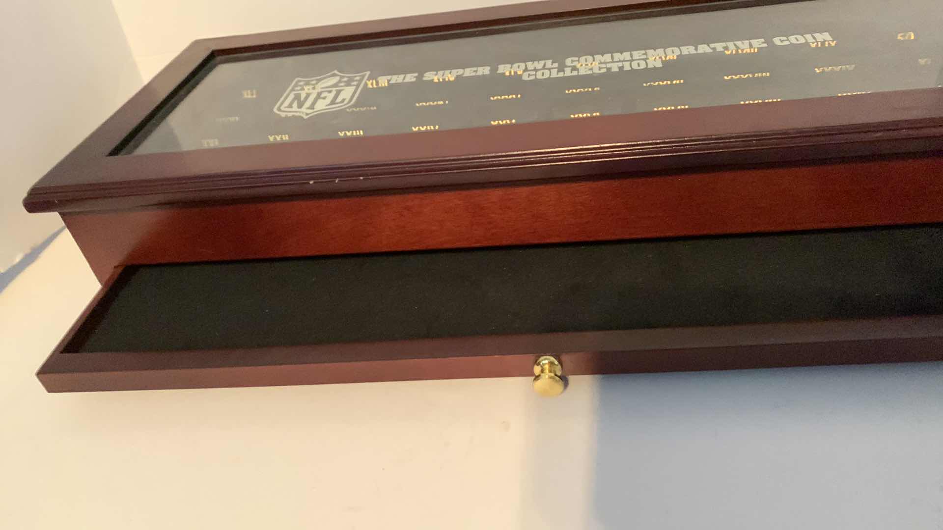 Photo 1 of NFL FOOTBALL SUPER BOWL COMMEMORATIVE COIN COLLECTION WOODEN DISPLAY CASE 19” C 7” H 2”