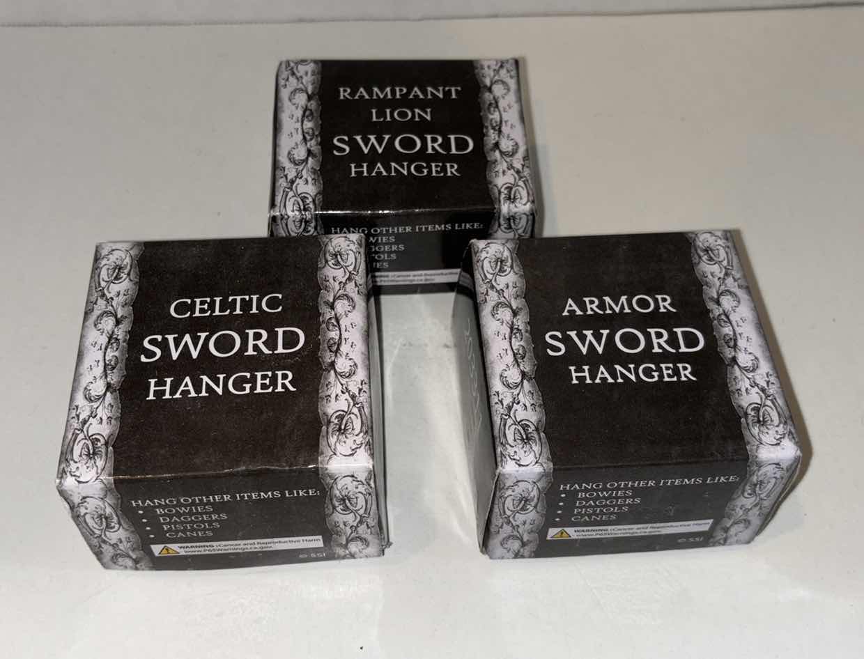 Photo 1 of 3- ASSORTED SWORD HANGERS (CELTIC, RAMPANT LION & ARMOR)