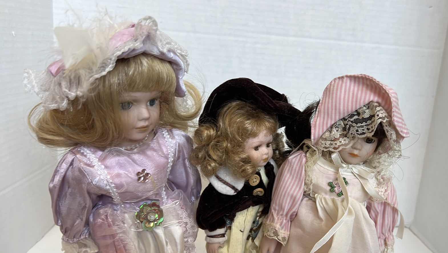 Photo 1 of 3 - PORCELAIN FACED DOLLS