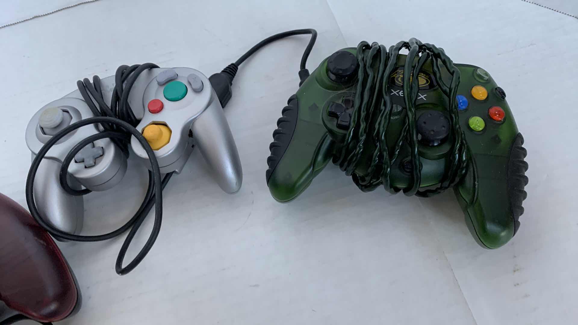 Photo 1 of 2-XBOX AND 1 NINTENDO GAME CUBE CONTROLLERS