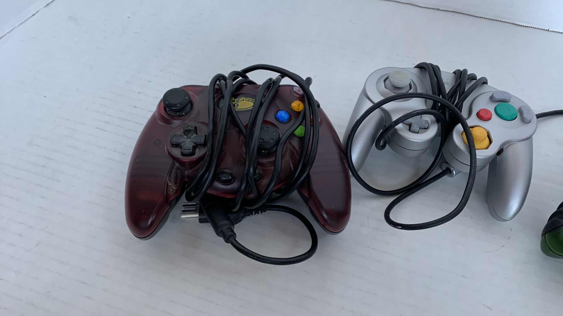 Photo 1 of 2-XBOX AND 1 NINTENDO GAME CUBE CONTROLLERS