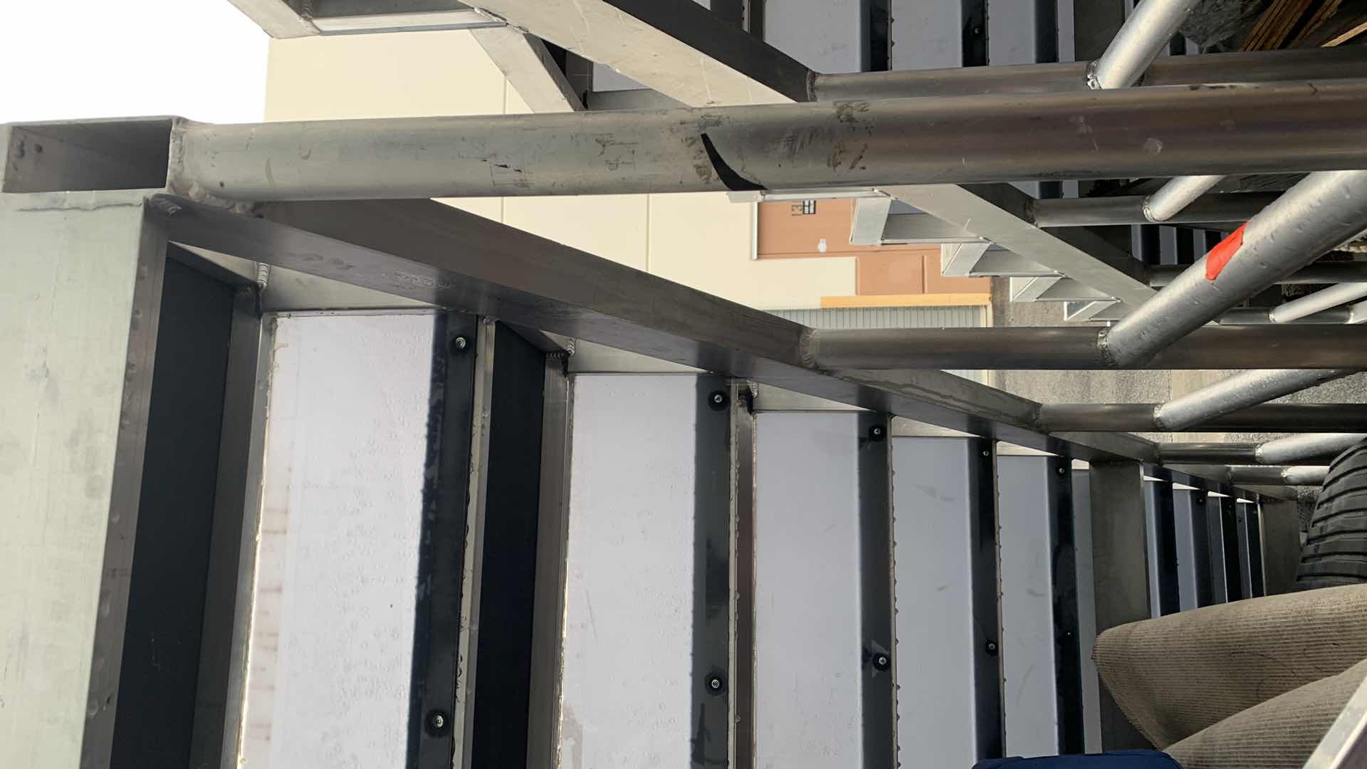 Photo 1 of ONE LARGE HEAVY DUTY ELEVEN STEP METAL AND PEXI-GLASS STAGE STAIRS WITH WHEELS 4’ X 12’ H 7’4” 