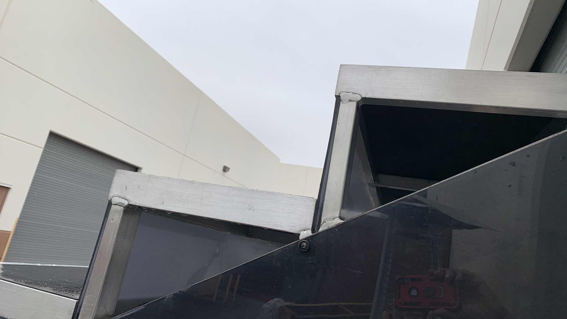 Photo 1 of ONE LARGE HEAVY DUTY ELEVEN STEP METAL AND PEXI-GLASS STAGE STAIRS WITH WHEELS 4’ X 12’ H 7’4” 