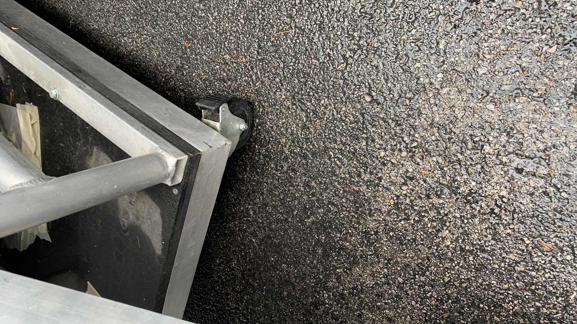 Photo 1 of ONE LARGE HEAVY DUTY ELEVEN STEP METAL AND PEXI-GLASS STAGE STAIRS WITH WHEELS 4’ X 12’ H 7’4” 