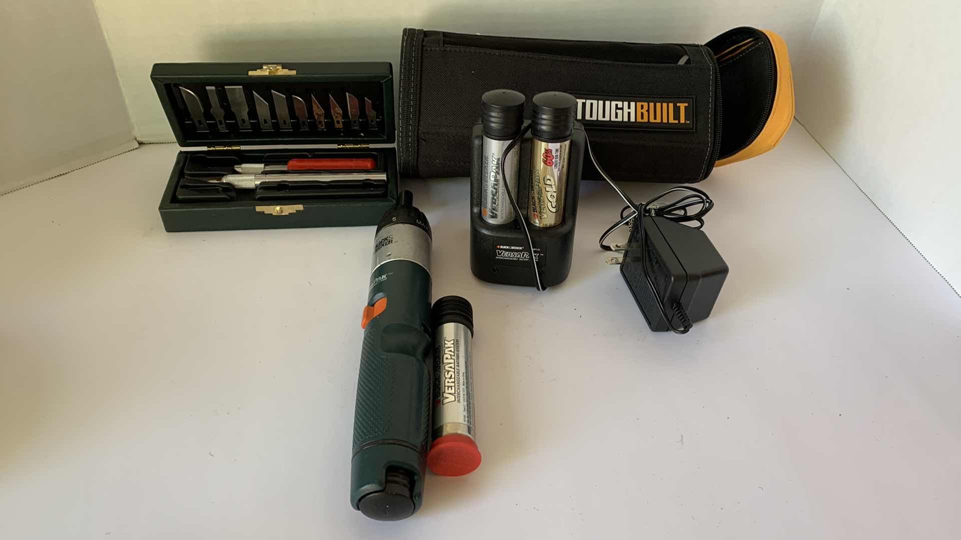 Photo 1 of BLACK AND DECKER VERSAPACK SCREWDRIVER WITH BATTERIES AND XACTO KNIFE SET