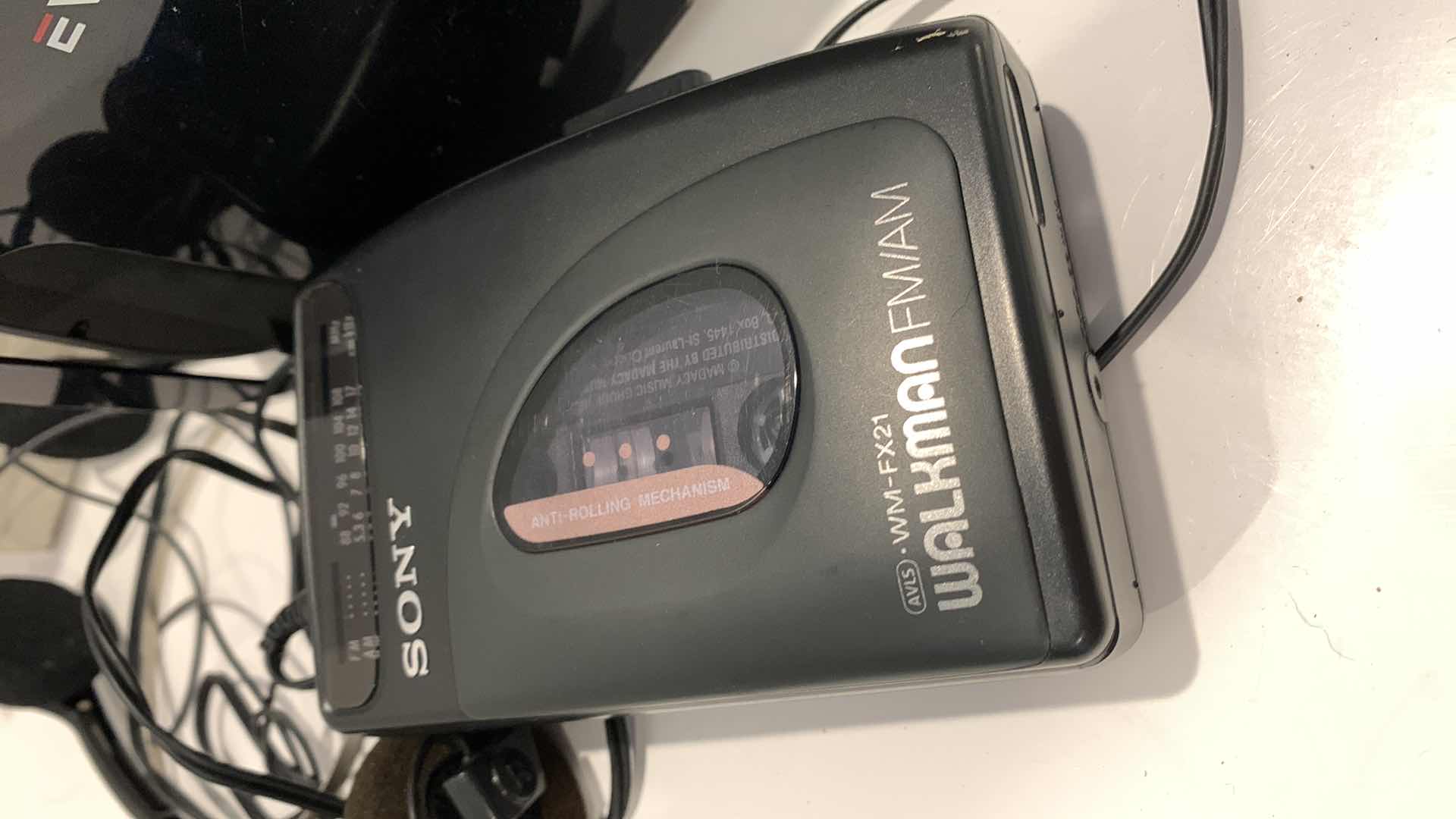Photo 1 of GARMIN, SONY CASSETTE WALKMAN, AND AN EVO VR HEADSET