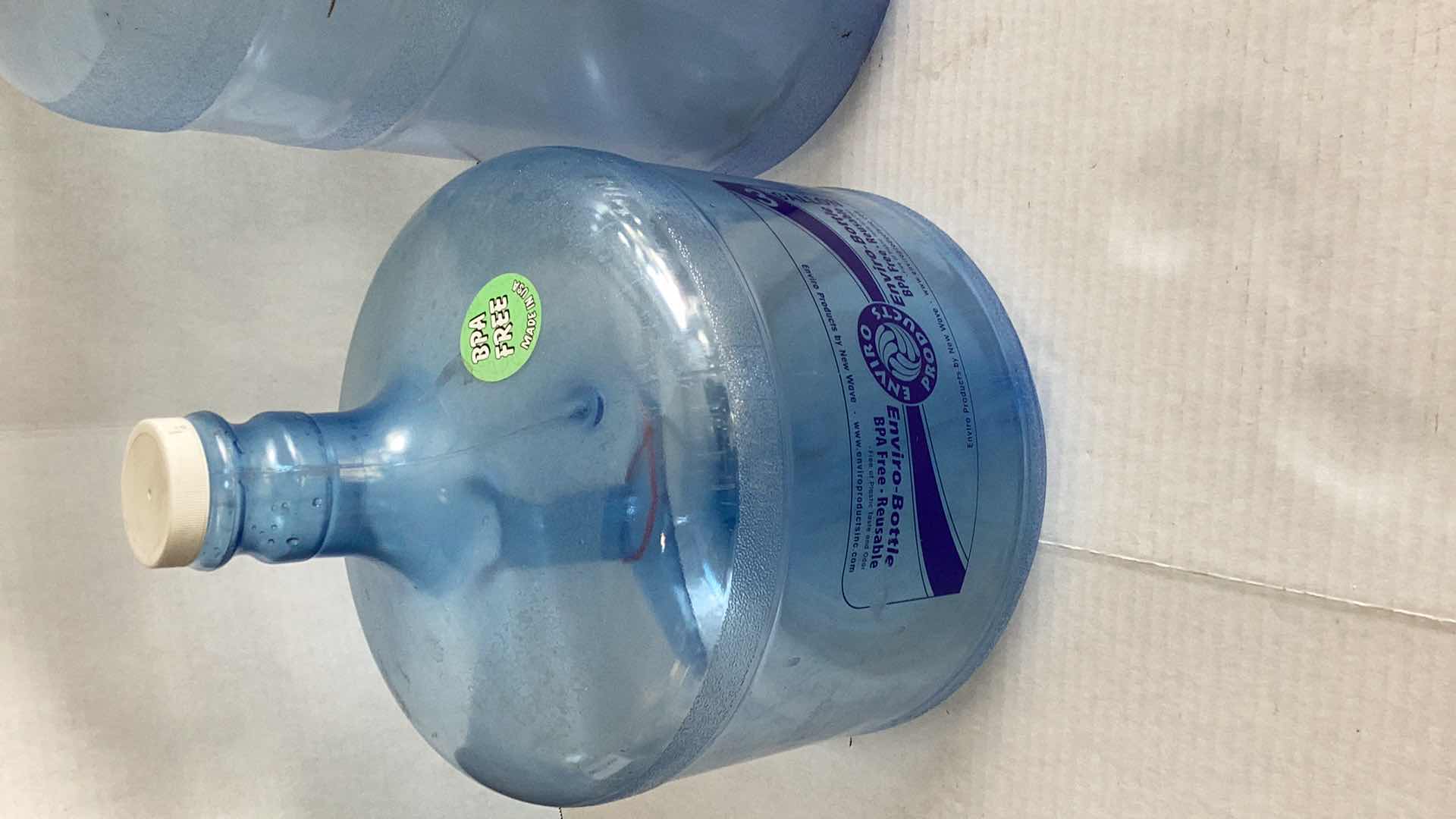 Photo 2 of THREE PLASTIC WATER BOTTLES